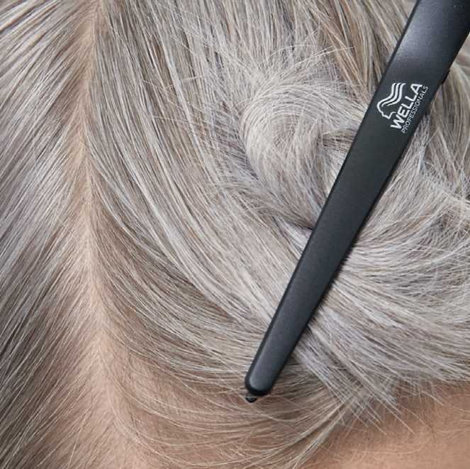 Close-up photo of gray hair clipped up.